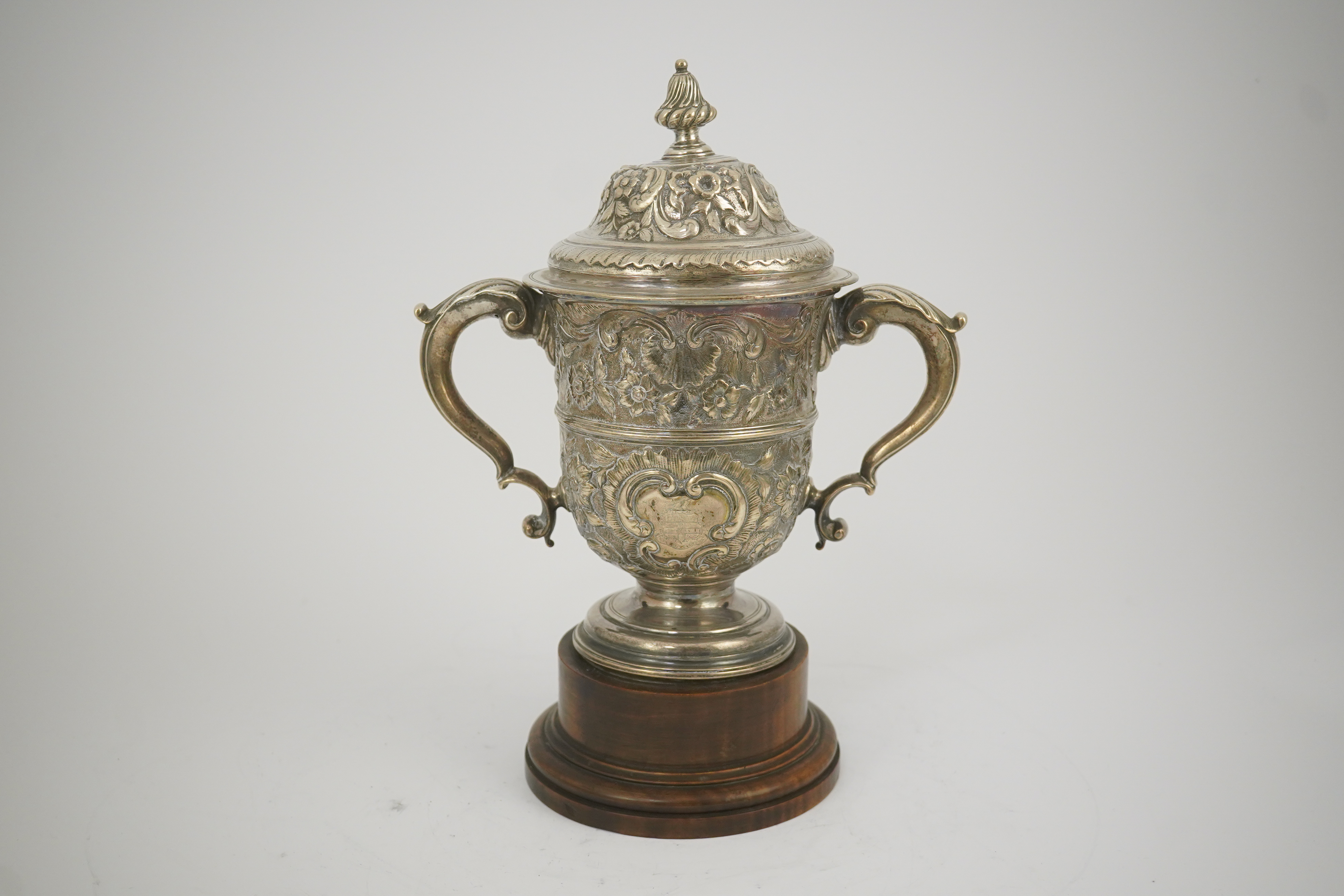 A George II silver loving cup with later floral embossed decoration, maker's initials RI, London, 1745